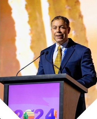 Portrait of Rolando Burgos speaking at IEEE 2024